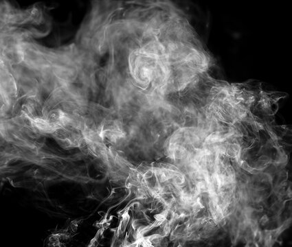 Smoke isolated on black background. © schankz