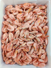 Lots of fresh shrimp. ingredients for cooking a festive dish. Frozen shrimp.