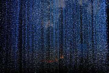 Defocused of lights curtain backdrop decoration with blue shine beautiful background