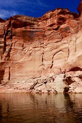 View of narrow cliff canyon from a boat in Glen Canyon National Recreation Area, Lake Powell, Arizona