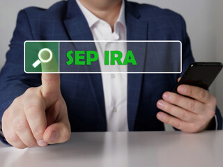 simplified employee pension individual retirement account SEP IRA phrase on the screen. Modern Banker use cell technologies at office. 