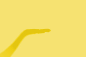 Concept modern abstract background of shadows hand on a wall. Illuminating Pantone Color Of The Year 2021.