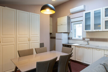 Kitchen interior with dining table and chairs