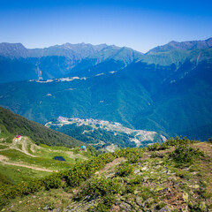 Fototapeta na wymiar Summer landscapes of the Caucasus mountains in Rosa Khutor, Russia, Sochi, Krasnaya Polyana. Peak 2320m