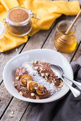 Teff grain porridge with banana topping for breakfast