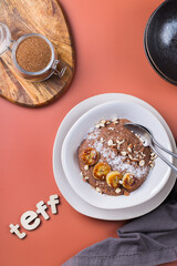 Teff grain porridge with banana topping for breakfast