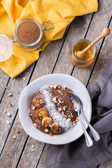 Teff grain porridge with banana topping for breakfast