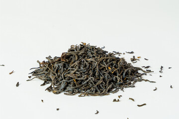 Dry black tea leaves on white back ground. Tea leaves isolated.