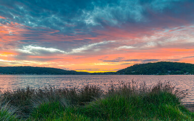 Sunrise at the waterfront with cloud cover