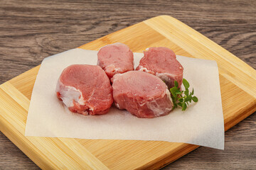 Raw pork medallion served rosemary