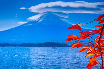 Japanese Destinations. Kawaguchiko Lake in Front of Picturesque Fuji Mountain with Boat in Foreground in Japan.