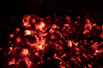Hot Red Coal Background. Burning Fire in the dark