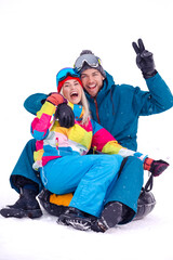 Wintersport Activities. Lovely Caucasian Couple Having Tube Activities In Winter Time And Posing Together And Laughing Outdoor.