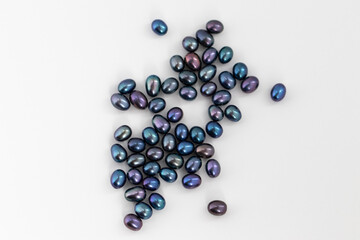 Dark Peacock Oval Pearls. Natural Freshwater Pearls on white background