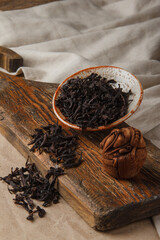 Chinese tea Da Hong Pao Oolong Tea. Dry loose Chinese tea leaves on wooden background. Space for...