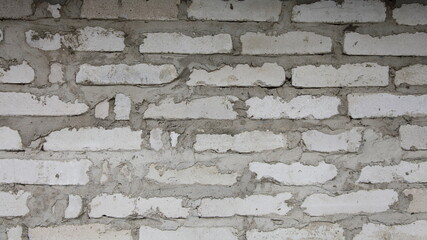Rough dry old white brick wall surface closeup - texture for background