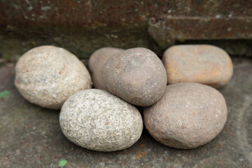 Fototapeta na wymiar Old dry five round stones closeup olympic symbol shape concept