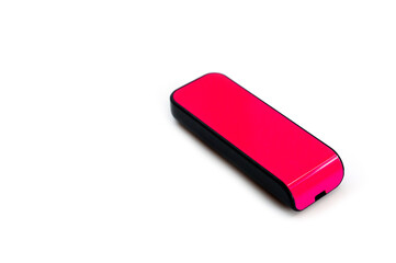 A pink USB flash drive with a plastic case, shot against a white background.