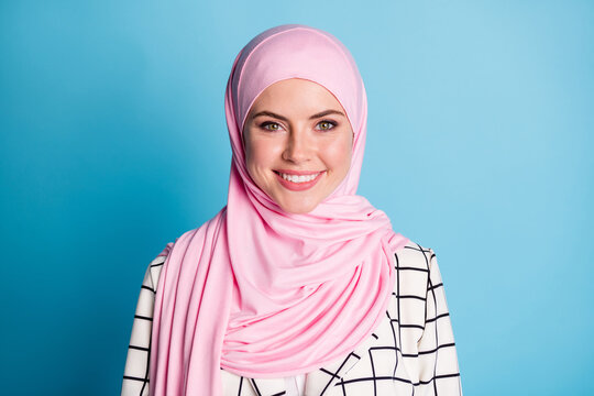 Photo of young adorable arabian girl happy positive smile wear hijab isolated over blue color background
