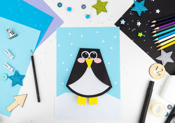 Step-by-step instruction of making a penguin out of paper with children. Step 6