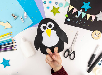 Step-by-step instruction of making a penguin out of paper with children. Step 5 © nadezhda