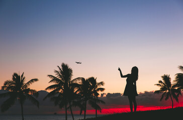 Girl by the seas at sunset, palm trees silhouette beautiful sky, Kakaako Waterfront Park, Honolulu, Oahu, Hawaii
- 419806967