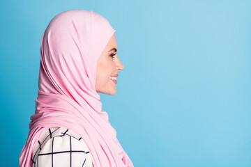 Close-up profile side view portrait of pretty cheerful content muslimah girl copy space isolated...
