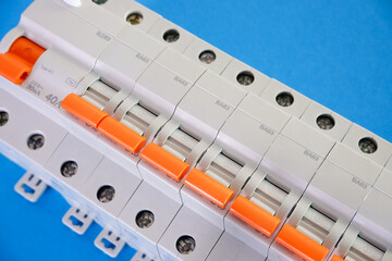 Automatic differential current switch and circuit breakers on a blue background. Electrical...