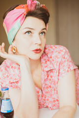 A beautiful girl in bright clothes and accessories. Retro style