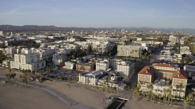 Aerial Forward: Luxurious City Near The Beach With Horizon View