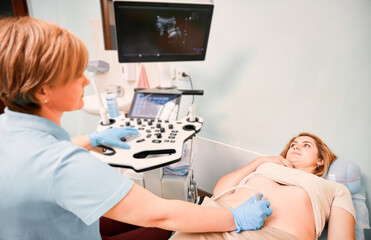 Female patient undergoing ultrasound procedure in medical center.
