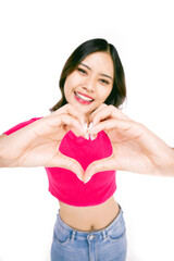 Cheerful beautiful girl making heart by hands isolated on a white background. Female hands making sign Heart by fingers,