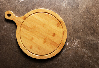 Pizza or bread cutting board for homemade baking on table. Food recipe concept at stone background