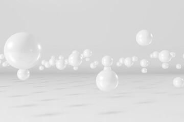 Fototapeta na wymiar White balls flying on a white background. Abstract 3d rendering scene