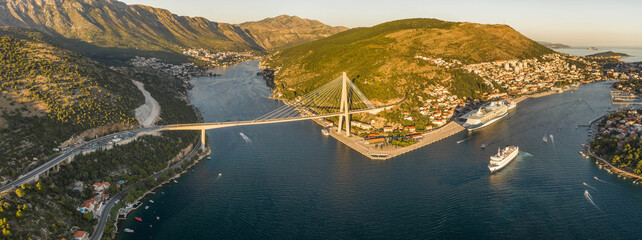 Aerial panorama drone shot of Dubrovnik bridge at Port Gruz in Lapad peninsula in Croatia summer sunset