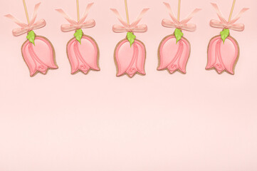 Gingerbread cookies in the shape of a tulip floral background with copy space