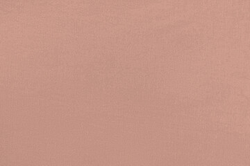 Peach homogeneous background with a textured surface