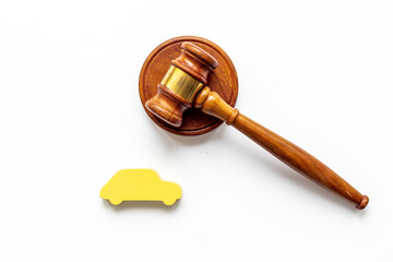 Car shape with judge gavel. Driving and insurance law concept