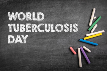 World Tuberculosis Day 24 March. Colored pieces of chalk on a gray chalk board