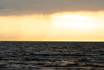 Fototapeta premium Sunset views in Latvia. Calm and beautiful Baltic sea at sunset