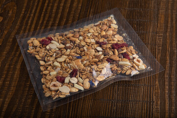 Granola with nuts in vacuum sealed plastic packaging