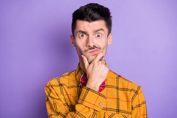 Photo of thoughtful distrusted young guy dressed checkered shirt bowtie hand arm chin isolated...