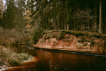 Naklejka na ściany i meble Stuku (Stūķu) Rock by the Amata river during cloudy autumn day in Latvia