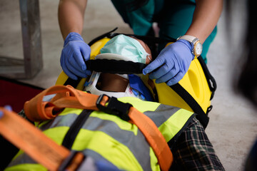 First aid for injuries in work accidents. Using first aid equipment support to loss of feeling or...