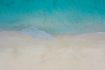 Fototapeta na wymiar Aerial top view of beach with sandy sea landscape with turquoise water background