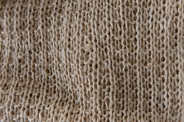Natural fabric handmade from rough hemp thread.