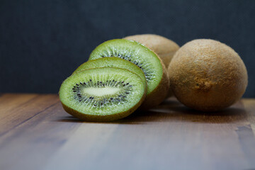 sliced kiwi close-up on wooden table