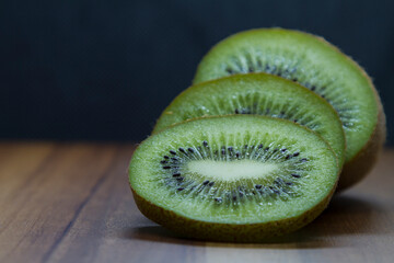 sliced kiwi close-up on wooden table