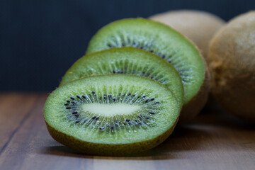 sliced kiwi close-up on wooden table