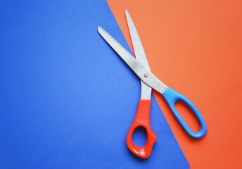 Scissors on colorful background